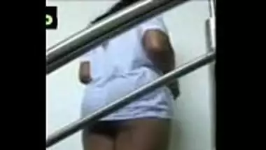 Busty aunty doing a naked walk in a staircase