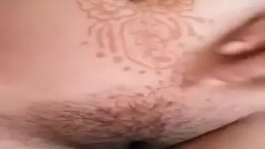 Desi woman shows hairy XXX hole besides tattoos on sexy tits and tummy
